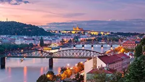 Prague at sunset. Cityscape image of Prague, capital city of Czech Republic with St. Vitus Cathedral and five bridges over Vltava River at autumn suns