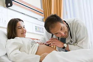 Ward Prints: Pregnant woman and doctor listening to stomach