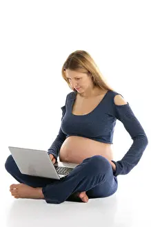 Squat Prints: pregnant woman with a laptop sitting on the floor