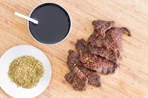 Lean Prints: Preparing beef jerky for drying with strips of lean beef