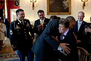 Behind The Scenes Prints: US President Barack Obama hugs Bertha Petry