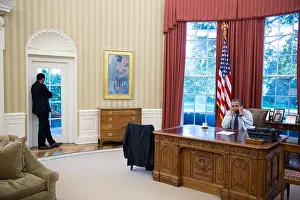 Behind The Scenes Prints: US President Barack Obama talks on the phone with Senate Minority Leader Mitch McConnell as Rob Nabors