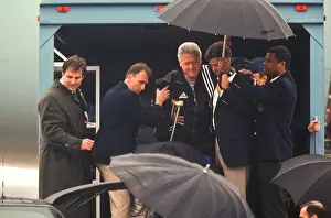 Injured Prints: President Bill Clinton Suffering a torn ligament in his right knee is carried off Air Force One