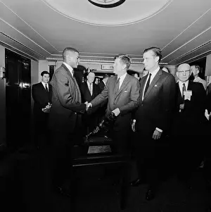 Kennedy Prints: President Kennedy greets 1961 Heisman Trophy winner Ernie Davis at a reception sponsored by the National Association of