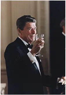 Meeting Prints: President Ronald Reagan is photographed toasting with Australian Prime Minister Malcolm Fraser during a state dinner