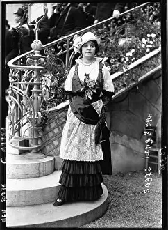 Apparel Prints: A press photograph documented fashion activity at Longchamps in 1914