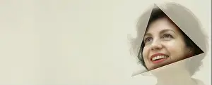 Middle Aged Woman Prints: Pretty business woman, successful and confidence looks into the hole of translucent colored paper