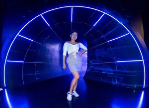 Follow Prints: Pretty girl in Blue neon light tunnel