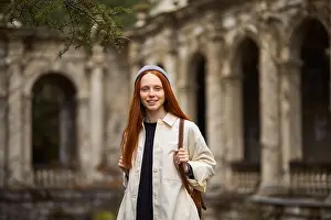 Admiring Prints: Pretty redhead woman in coat in search of beautiful historical place