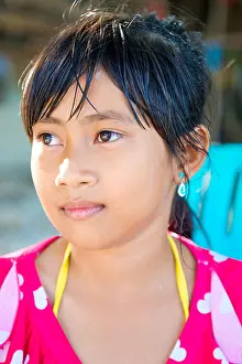 Grinning Prints: Pretty young Asian Thai girl smiling with beautiful eyes on the beach