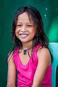 Manila Prints: A pretty young Filipino girl poses and smiles for my camera in the old walled city of Intramuros