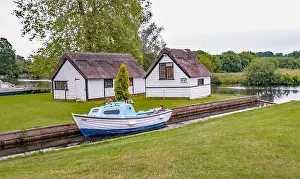 Boat House Prints: Private mooring dyke and boat house off the River Bure in the village of Coltishall in the heart of the Norfolk Broads
