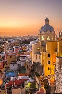 Procida, Italy old town skyline in the Mediterranean Sea during dusk
