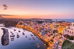 Procida, Italy old town skyline in the Mediterranean Sea during dusk