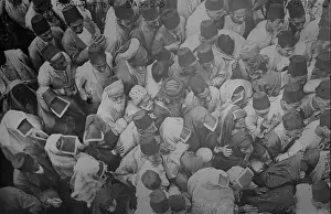 Veil Prints: Proclamation, Baghdad, 1917. A crowd of men and women in Baghdad