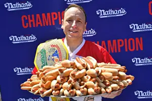 Eating Prints: Professional competitive eater Joey Chestnut wins his 15th title eating 63 Nathan's hot dogs at the 2022