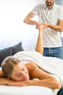 Massaging Prints: Professional masseur doing therapeutic massage