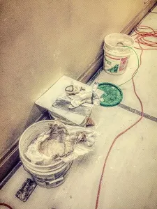 Blue Collar Prints: Professional painters plastering materials at job site