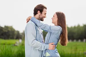 Adore Prints: Profile side photo of two people lovely smiling couple hug embrace each other admire free time together outdoors