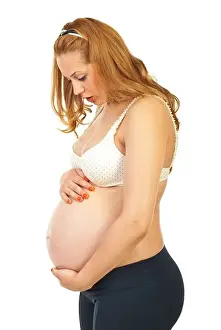 Feel Prints: Profile of surprised pregnant woman of her baby movements isolated on white background