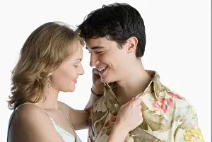 Toothy Smile Prints: Side profile of a young woman adjusting a young man's collar