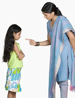 One Young Woman Only Prints: Side profile of a young woman scolding her daughter