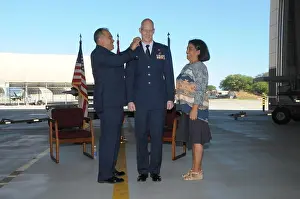 Professionalism Prints: A promotion ceremony is held at Joint Base Pearl Harbor-Hickam