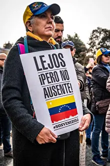 Juan Prints: A protester is seen holding a placard during the protest