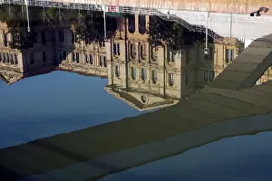 Underneath Prints: Puente Pedro Arrupe bridge and Deusto University reflected in River Nervion