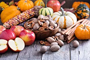 Thanksgiving Prints: Pumpkins, nuts, indian corn and apples on a rustic table