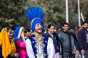 Punjabi Prints: Punjabi Bhangra, Portrait of young sikh male in traditional punjabi colorful dress