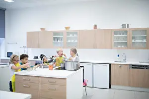 Asians Prints: Pupils cooking together in cooking class