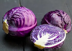 Nutrients Prints: Purple cabbage isolated on rustic black wooden background closeup