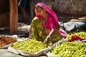 Street Market Prints: Pushkar street scene, woman selling fruits, Pushkar, Rajasthan, India