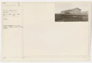Recruitment Prints: Pvt. W.J. Beach of the U.S. Military poses in front of stucco barracks in Gievres