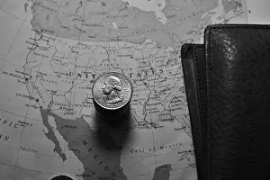 Financial Planning Prints: US Quarter dollar is stacked under United States geographical map with wallet