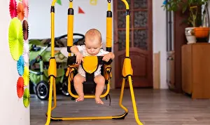 Infant Prints: Quiet cute baby boy in a swing home