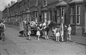 Playing Prints: Rag and Bone man with horse and cart surrounded by children in street Birmingham West Midlands Uk 1950s Britain