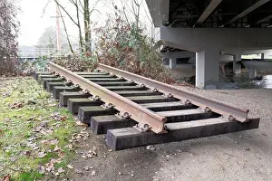 Train Track Prints: Railroad section separated from the train tracks underneath an overpass in Renton