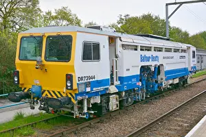 Rails Prints: Railway track maintenance machine manufactured by Plasser & Theurer & operated by Balfour Beatty stationary in siding