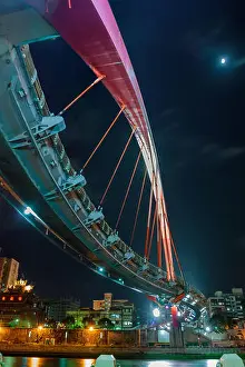 Sky Landscape Prints: The Rainbow Bridge seen in the moonlight and the city lights in Taipei, Taiwan