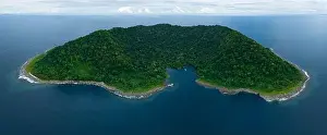 Rainforest covers the remote Mary Island which is fringed by a coral reef in the Solomon Islands. This country is home to amazing marine biodiversity