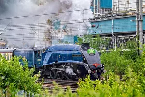 A rainy day at Warrington Bank Quay station as the A4 Pacific loco Sir Nigel Gresley steams out hauling the Saphos