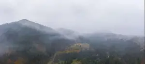 Boring Prints: Rainy foggy and gray weather in the mountain valley of the Carpathians in Ukraine in small village Aerial panoramic