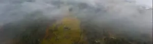 Boring Prints: Rainy foggy and gray weather in the mountain valley of the Carpathians in Ukraine in small village Aerial panoramic