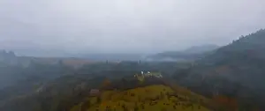 Boring Prints: Rainy foggy and gray weather in the mountain valley of the Carpathians in Ukraine in small village Aerial panoramic