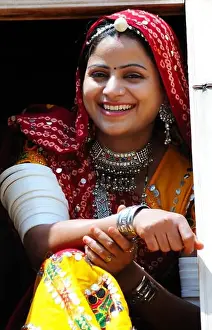Rajasthani lady looking through window ; Rajasthan ; India MR#769C