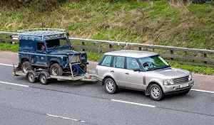 Restore Prints: Range Rover towing decrepit dilapidated old Land Rover Defender