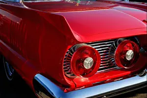 Restore Prints: Rear view of 1959 red Ford thunderbird