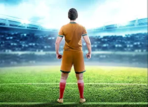 Professional Athlete Prints: Rear view of football player man standing in the middle of football field on stadium
